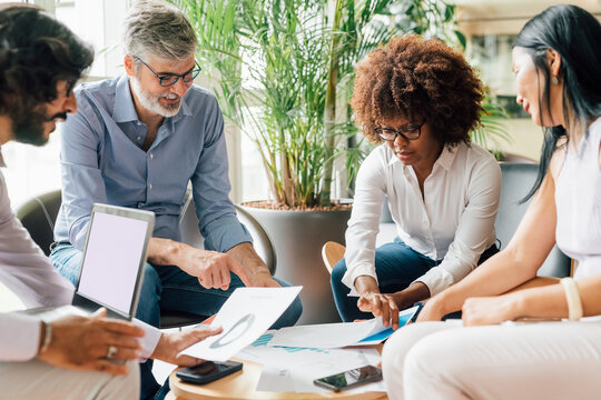Italy, Business people having meeting in creative studio