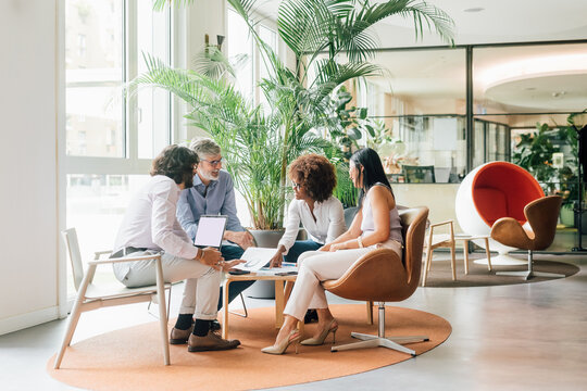 Italy, Business people having meeting in creative studio