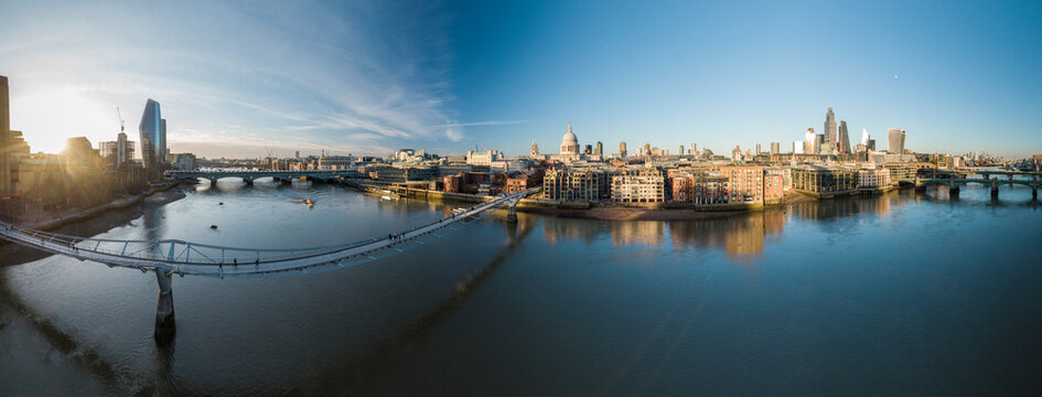 UK, London, High angle view of Millennium Bridge over River Thames at sunset