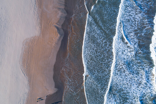 Spain, Valencia, Overhead view of sea waves beach