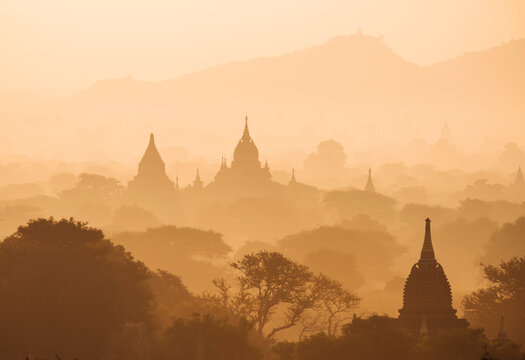Myanmar, Bagan, view of temples in morning mist