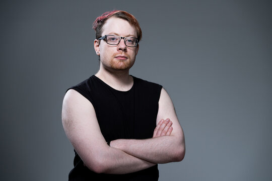 Studio portrait of man wearing eyeglasses and blank sleeveless top