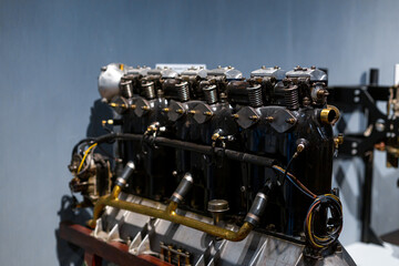 Close-up of a detail of a rare car engine. Metal mechanisms. Automotive industry