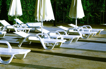 sun loungers in summer on a sunny day in nature