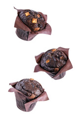 Sweet fresh chocolate muffin with chocolate slices on a white isolated background