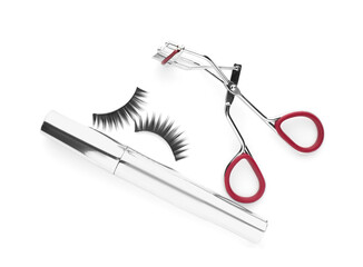 False eyelashes, curler and mascara on white background, top view