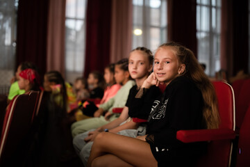 Children watching movie in cinema