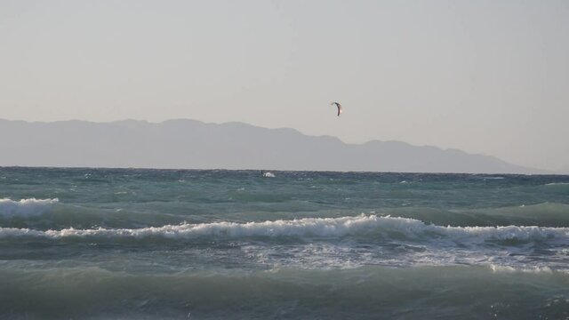 A man riding a wave on top of a body of water