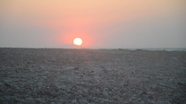 A sunset over a beach