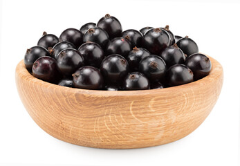 black currant in wooden bowl isolated on white background. macro. clipping path