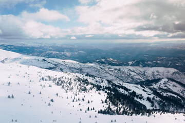 Obraz premium Panorama of the ski resort Kopaonik in Serbia. Kopaonik National Park, winter landscape in the mountains.