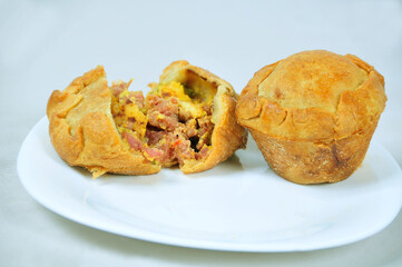 delicious chicken pie, typical of Brazilian cuisine, baked and stuffed with chicken, potato, cheese, olive and cream