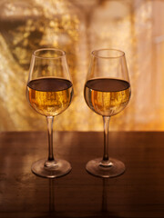 two wine glasses with white wine