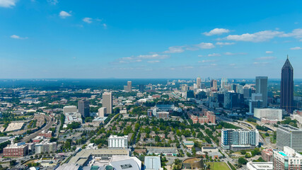 Fototapeta na wymiar a stunning aerial shot of the city skyline with skyscrapers in downtown Atlanta Georgia with blue sky and clouds