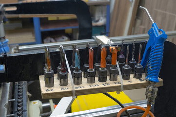 set of cutters or drill for threading is in the workshop. The various size of drilling tool. 