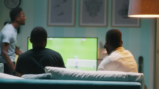 Black guys arguing about soccer game