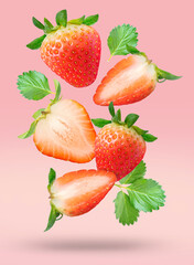 Red strawberries with leaves falling in the air isolated on pink background, Strawberry on pink background With clipping path.