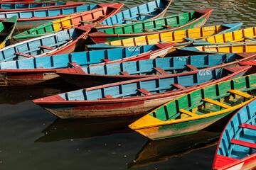 Fototapeta na wymiar Close-up of colourful boats in Phewa lake, Pokhara, Nepal