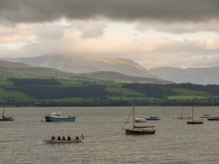 River Menai view from Anglesey, Welsh mountains hills and valleys under clouds