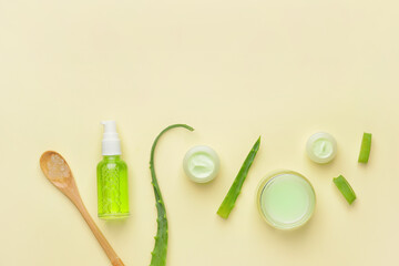 Different cosmetic products with aloe on light background