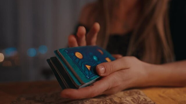 Fortune teller female hands and tarot cards