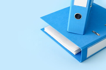 Office folders on color background