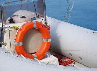 Life buoy on small pneumatic motor boat