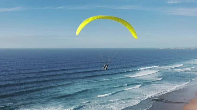 Cordoama Viewpoint. Vila do Bispo. Portugal. Aerial coastal views over European wilderness by the Atlantic. Epic scenery of a paraglider flying over azure ocean. High quality 4k footage