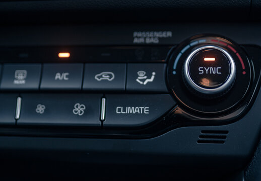 Closeup of a heat control panel of a modern car under the liht