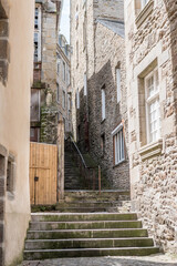 Buildings and stairs in the old city of Saint-Malo, France - obrazy, fototapety, plakaty