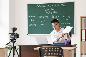 Asian teacher conducting English lesson online