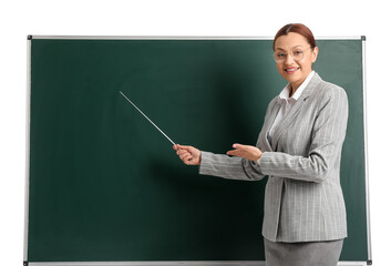 Portrait of female teacher near chalkboard on white background