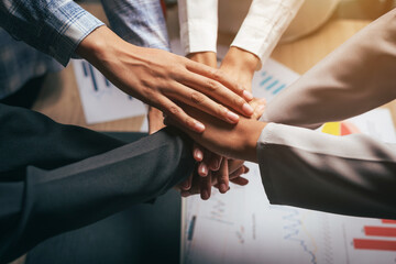 Business people joining hands, teamwork concept. close-up