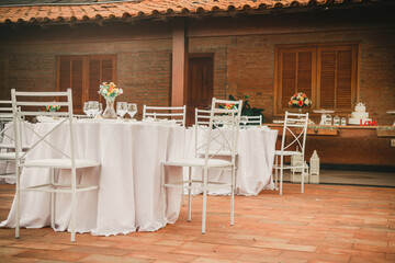 Beautiful Brazilian wedding party, outdoor, decoration and many wedding sweets at sunset, love story