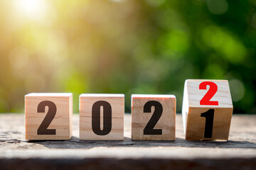 Wooden blocks with 2021 2022 number on wooden table with copy space, New year, Merry christmas.