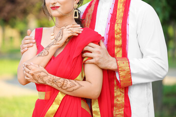 Fototapeta na wymiar Beautiful Indian wedding couple outdoors