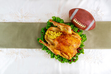 Thanksgiving football game concept. Festive turkey with garnish.