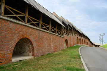 View of the red brick walls of the fortress of the ancient Kremlin from the courtyard in Kazan, Russia