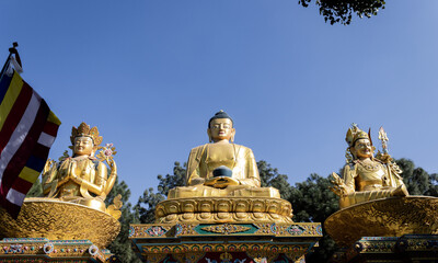Fototapeta na wymiar Golden statue of Buddha at Buddha Park, Swayambhunath, Kathmandu, Nepal
