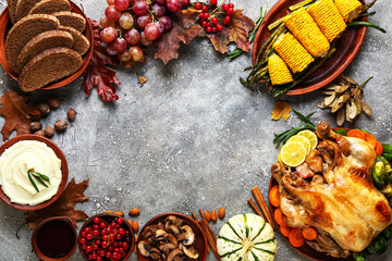 Frame made of tasty baked turkey and different food for Thanksgiving Day on grunge background