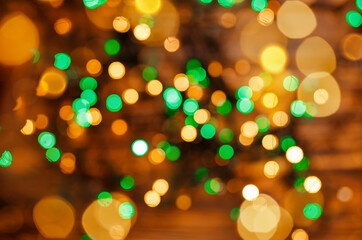 Obraz na płótnie Canvas Glowing magic bokeh. Defocused lights background. Defocused gold lights. Abstract holiday background. Beautiful shiny Christmas lights. Twinkle lights bokeh. Blurred Christmas sparkles. Holidays