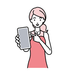 立ってスマートフォンを指差してこちらに向けて見せているドレスの女性