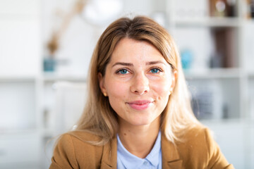 optimistic adult female person posing in white office