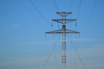  Power transmission towers against the blue sky.