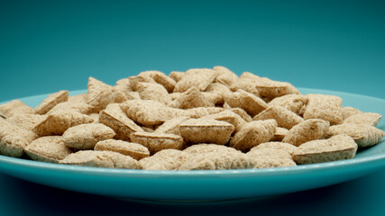 Fitness cereal breakfast on a blue dish, Close up - 460215181