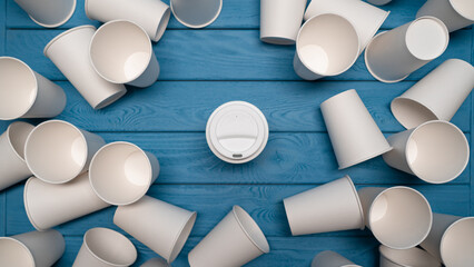 ZERO WASTE: One reusable mug and a many paper cups on a blue table, Top view - 460215189
