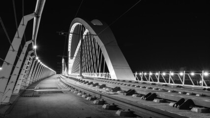 Fototapeta na wymiar The bridge in Kehl in Germany in black and white at night