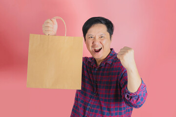 40 year old young man holding shopping bags