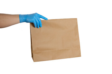 Close up hand in medical glove and holding food paper bag on white background