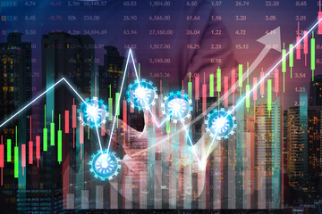 Double exposure of businessman using the tablet with cityscape